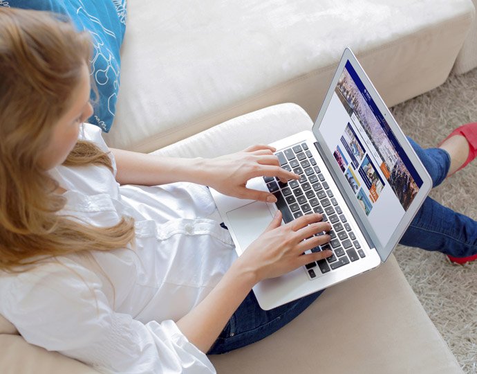 Person browsing MSC Cruises website on a laptop | MSC Cruises Person browsing MSC Cruises website on a laptop | MSC Cruises