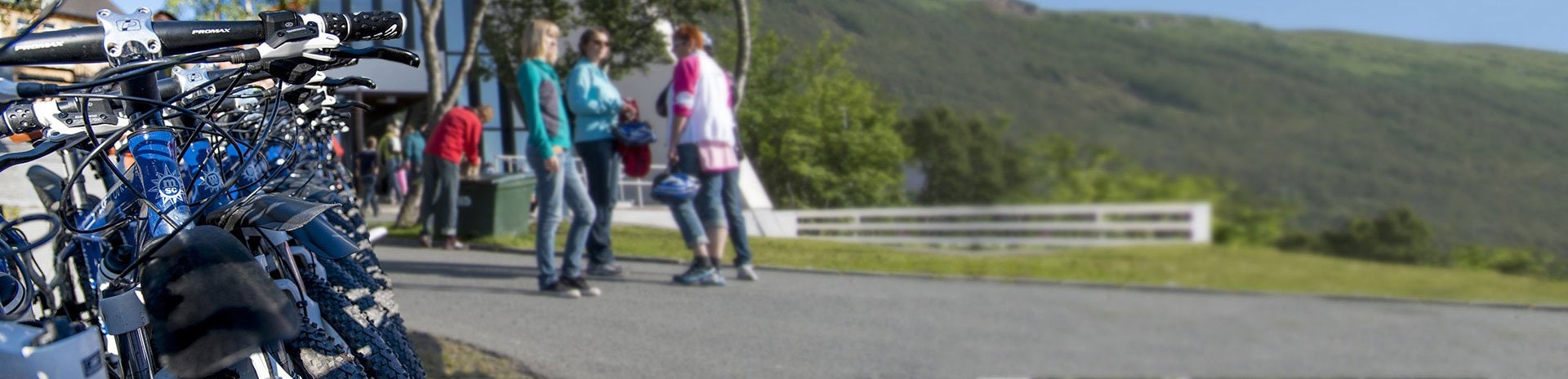 Bicycles lined up for a shore excursion with scenic mountain views | MSC Cruises Bicycles lined up for a shore excursion with scenic mountain views | MSC Cruises