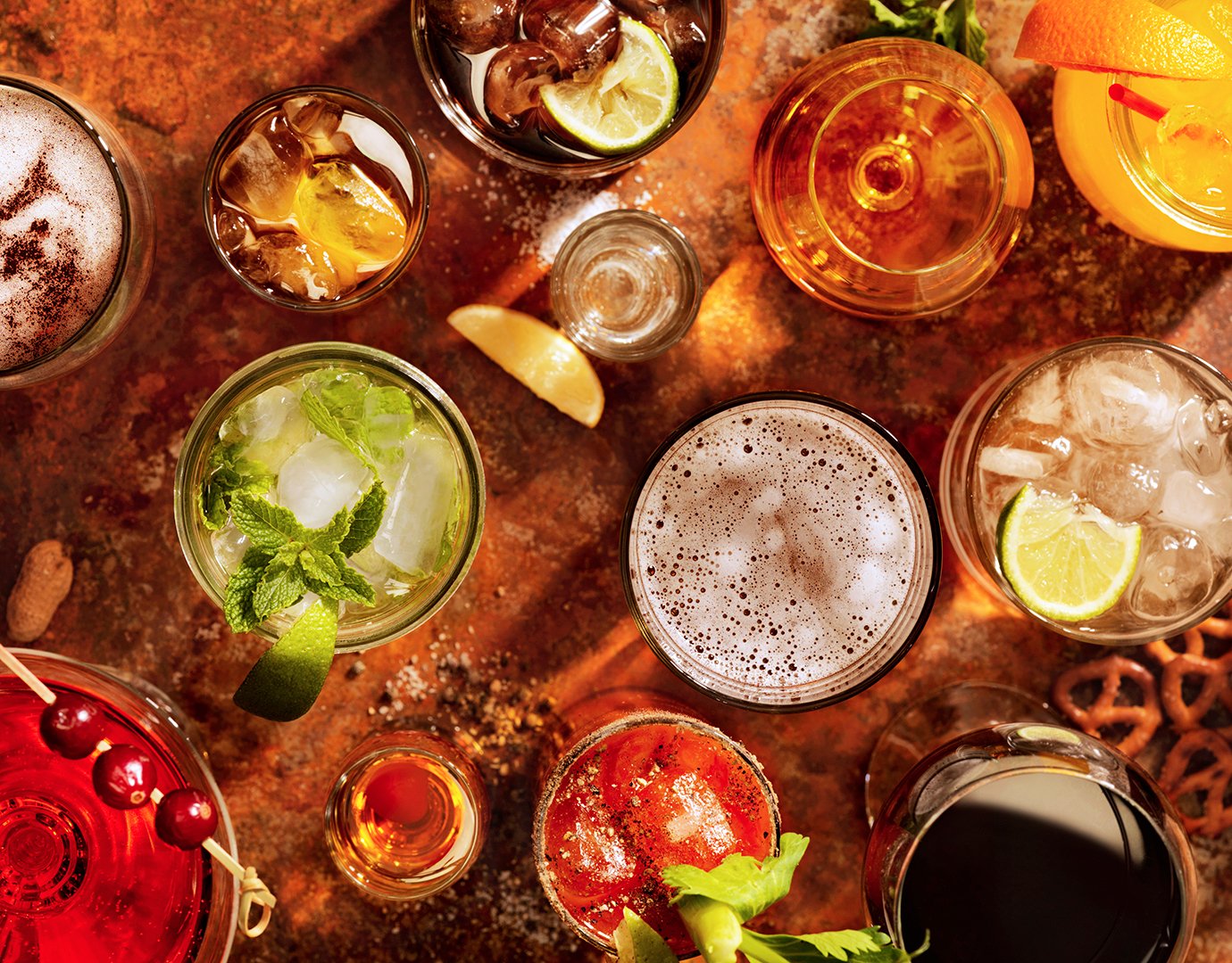 Assorted colorful cocktails and drinks on a rustic table | MSC Cruises